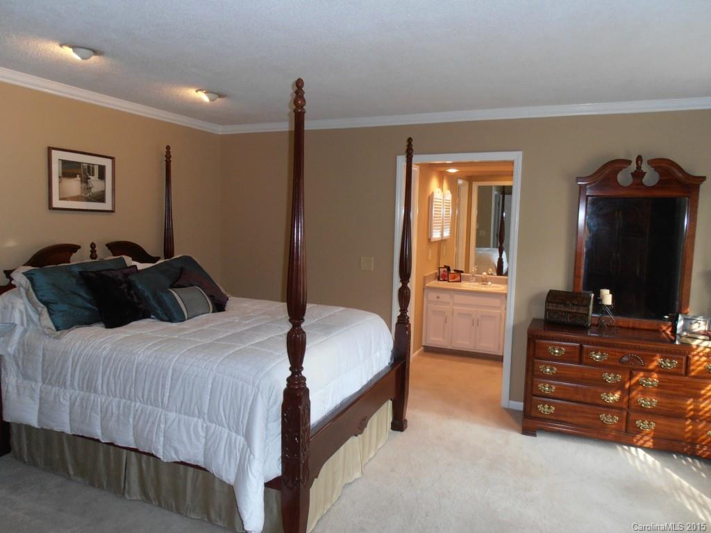 11031 Painted Tree Road Charlotte, NC 28226 - Photo 14 of 15 a bedroom with a bed and a flat screen tv