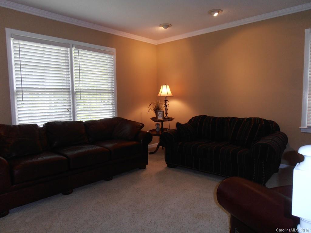 11031 Painted Tree Road Charlotte, NC 28226 - Photo 15 of 15 a living room with furniture and a lamp