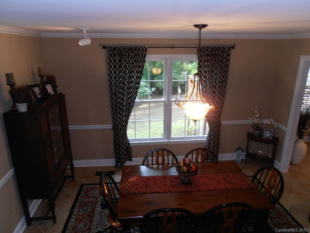 11031 Painted Tree Road Charlotte, NC 28226 - Photo 4 of 15 a view of a dining room with furniture window and outside view
