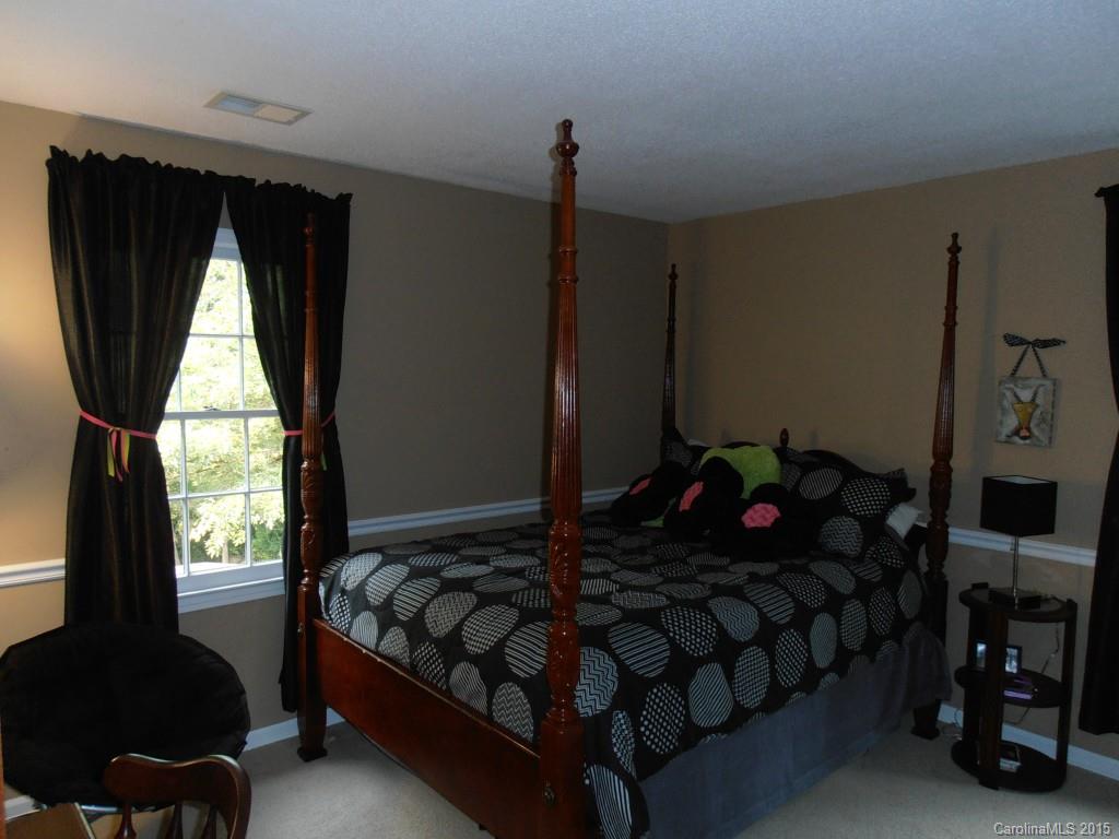 11031 Painted Tree Road Charlotte, NC 28226 - Photo 8 of 15 a bedroom with furniture and a window