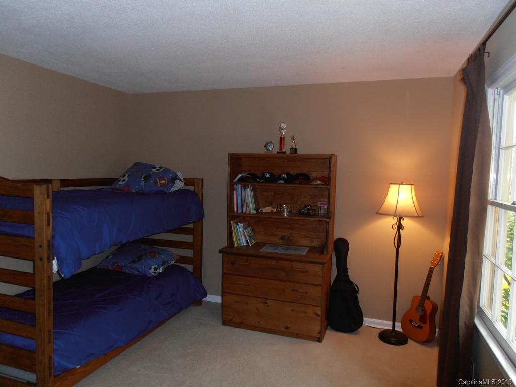 11031 Painted Tree Road Charlotte, NC 28226 - Photo 9 of 15 a room with a bed and a closet