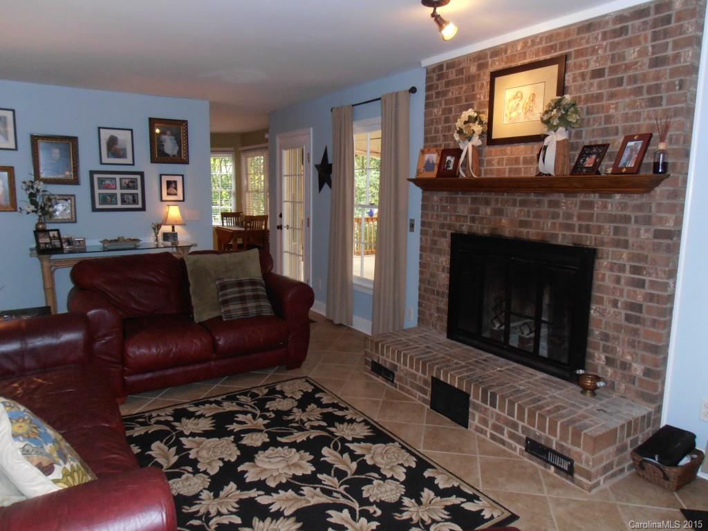 11031 Painted Tree Road Charlotte, NC 28226 - Photo 10 of 15 a living room with furniture and a fireplace