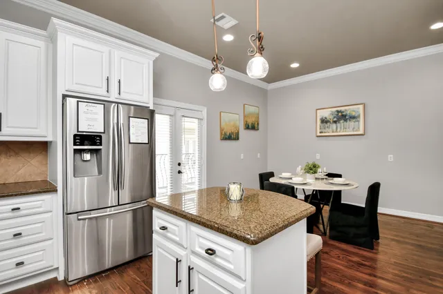 a bedroom with a bed and a lamp