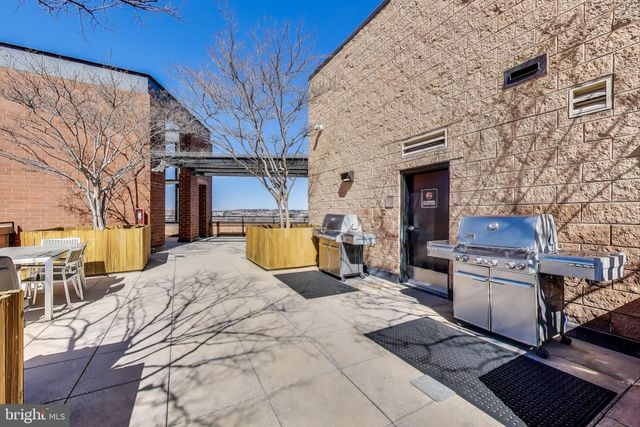 a view of a backyard with sitting area