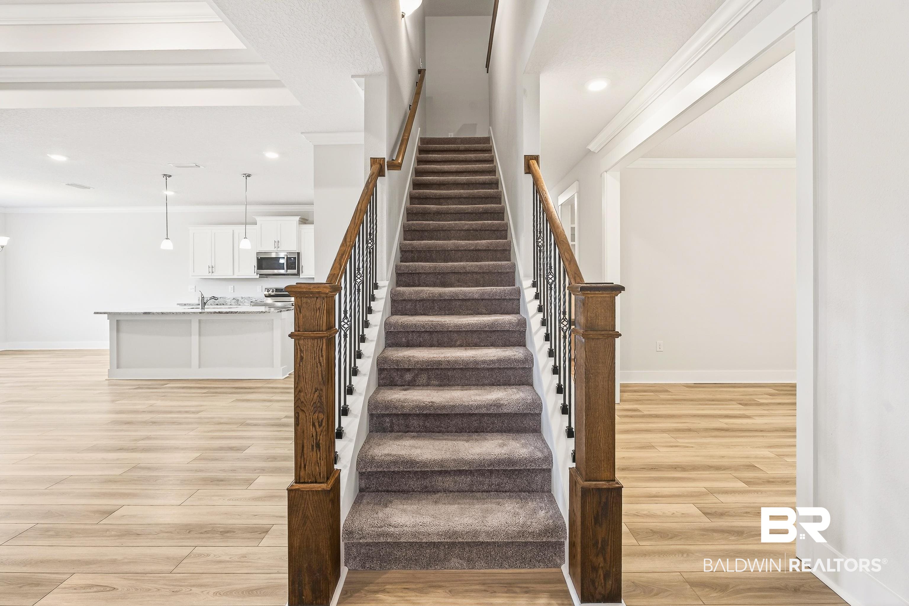 1728 Partridge Street Foley, AL 36535 - Photo 35 of 37 Stairs with wood finished floors and crown molding