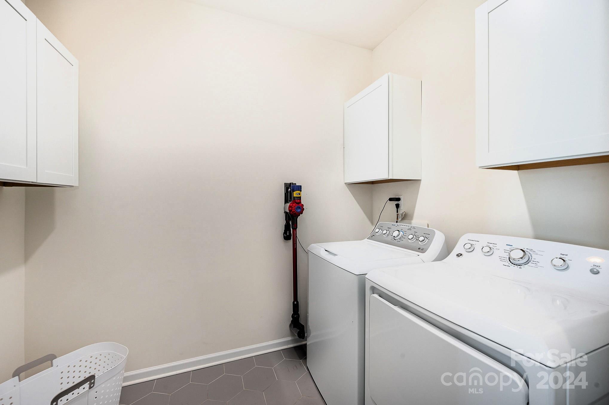 641 Amber Meadows Way Tega Cay, SC 29708 - Photo 14 of 28 a utility room with dryer and washer