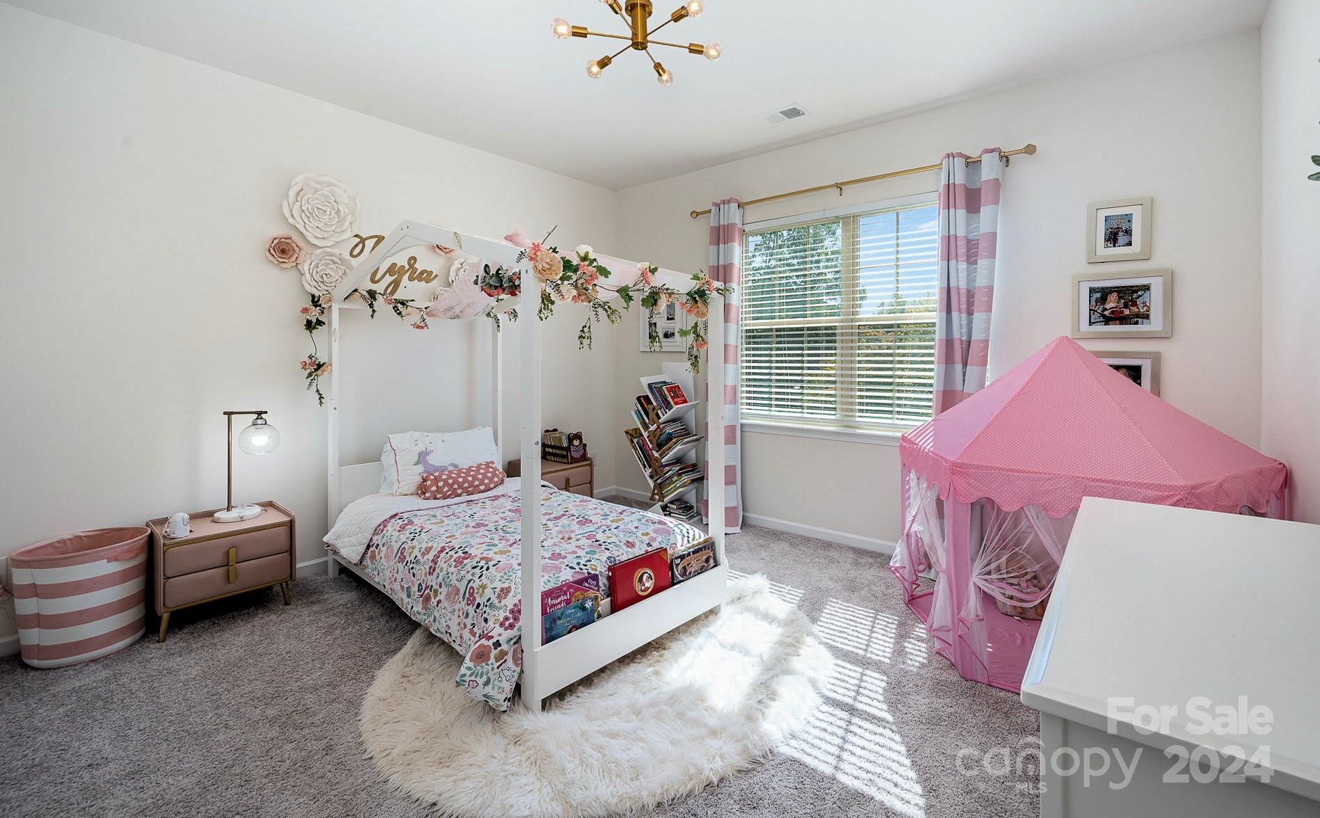 641 Amber Meadows Way Tega Cay, SC 29708 - Photo 20 of 28 a bedroom with a bed and a window