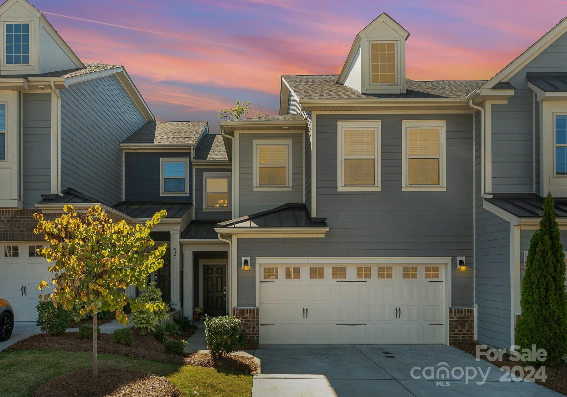 641 Amber Meadows Way Tega Cay, SC 29708 - Photo 28 of 28 a front view of a house with garden