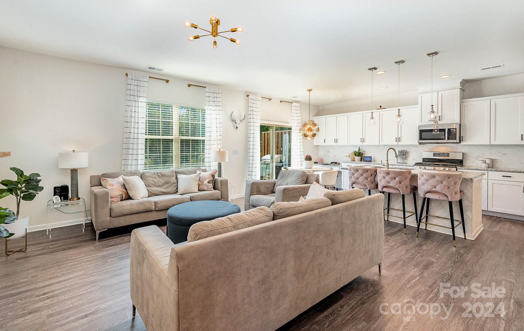 641 Amber Meadows Way Tega Cay, SC 29708 - Photo 5 of 28 a living room with furniture and a large window