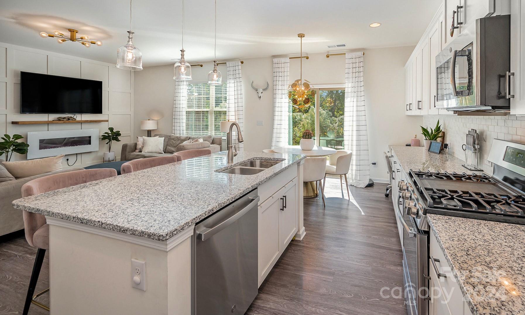 641 Amber Meadows Way Tega Cay, SC 29708 - Photo 10 of 28 a kitchen with sink stove and refrigerator