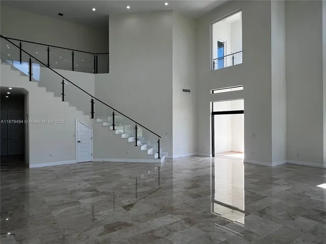 a view of entryway and hall with a window