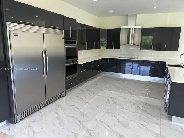 a room with walk in closet and wooden floor