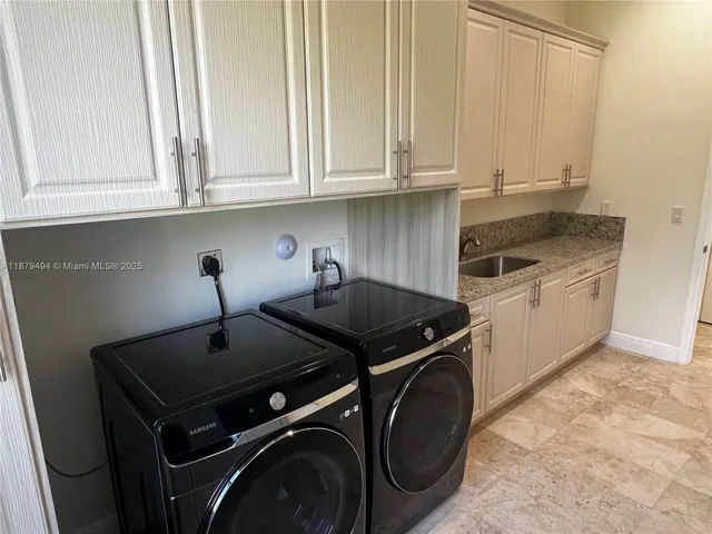 a view of a glass door with a balcony from a room