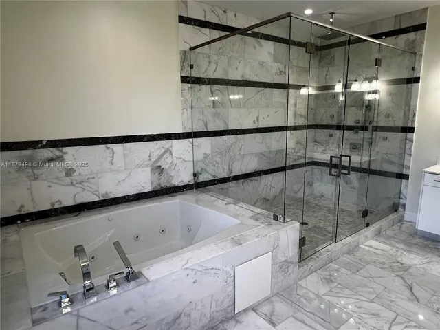 a bathroom with a shower and toilet