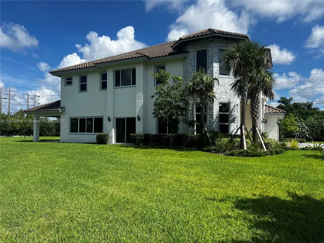 a view of a lake with a house in the background