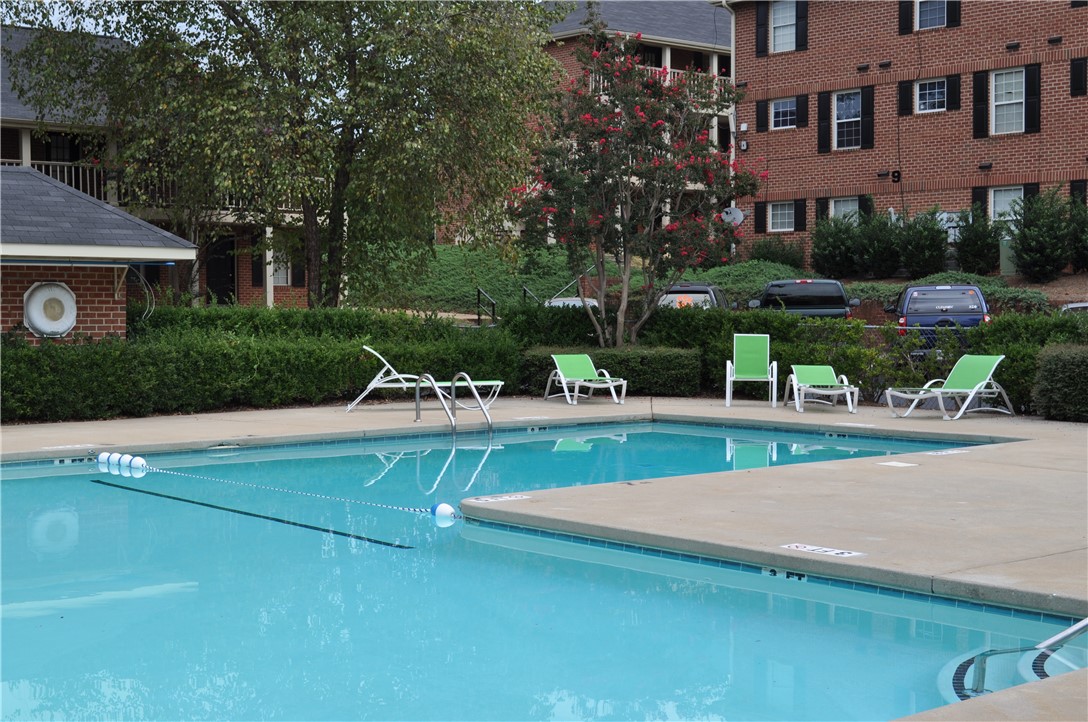 250 Elm Street Clemson, SC 29631 - Photo 1 of 7 A refreshing outdoor pool offers relaxation amidst mature landscaping and residential buildings.