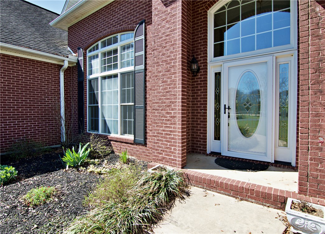 7893 Athens Road Carnesville, GA 30521 - Photo 4 of 50 This classic brick residence welcomes you with an elegant entrance and well-maintained landscaping.