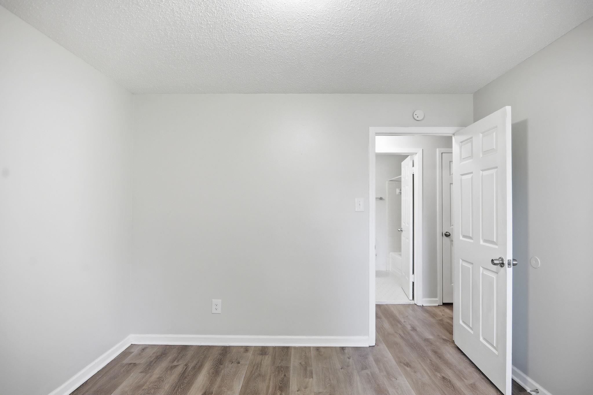3113 Raleigh Ridge Cove Memphis, TN 38128 - Photo 18 of 38 Room featuring wood-finish flooring and light gray walls