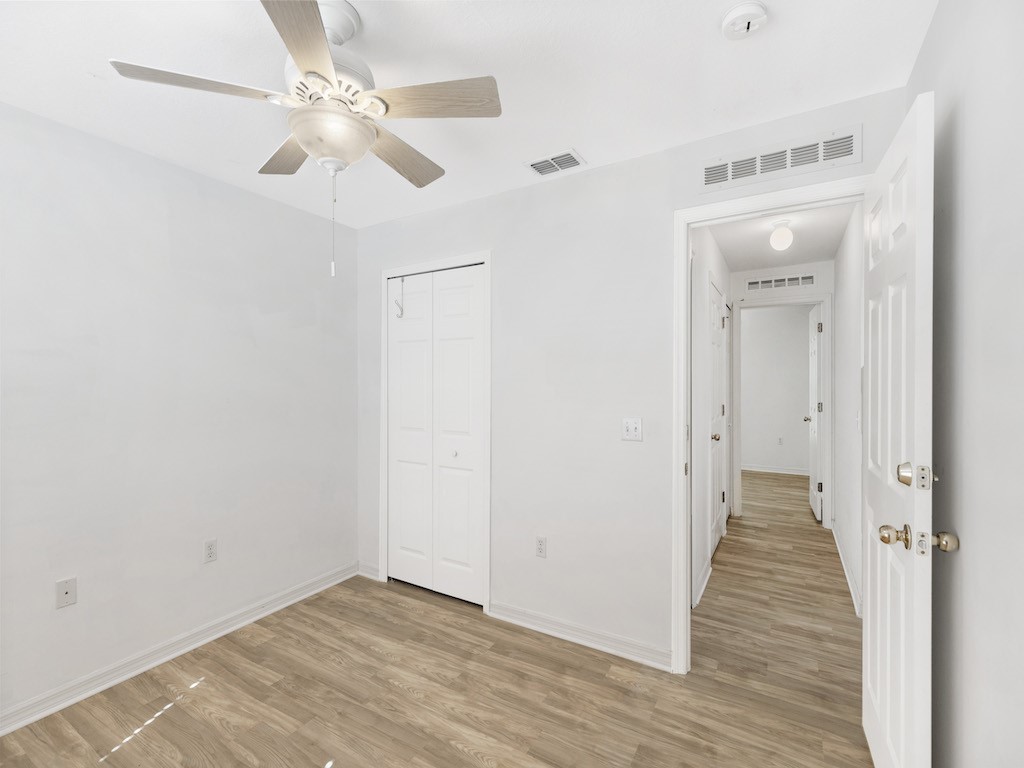 2575 12th Square Southwest Vero Beach, FL 32968 - Photo 17 of 31 a view of a hallway with wooden floor