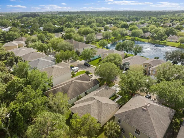 an aerial view of a house with a lake view