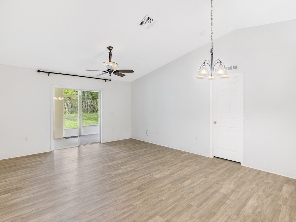 2575 12th Square Southwest Vero Beach, FL 32968 - Photo 6 of 31 a view of a room with wooden floor