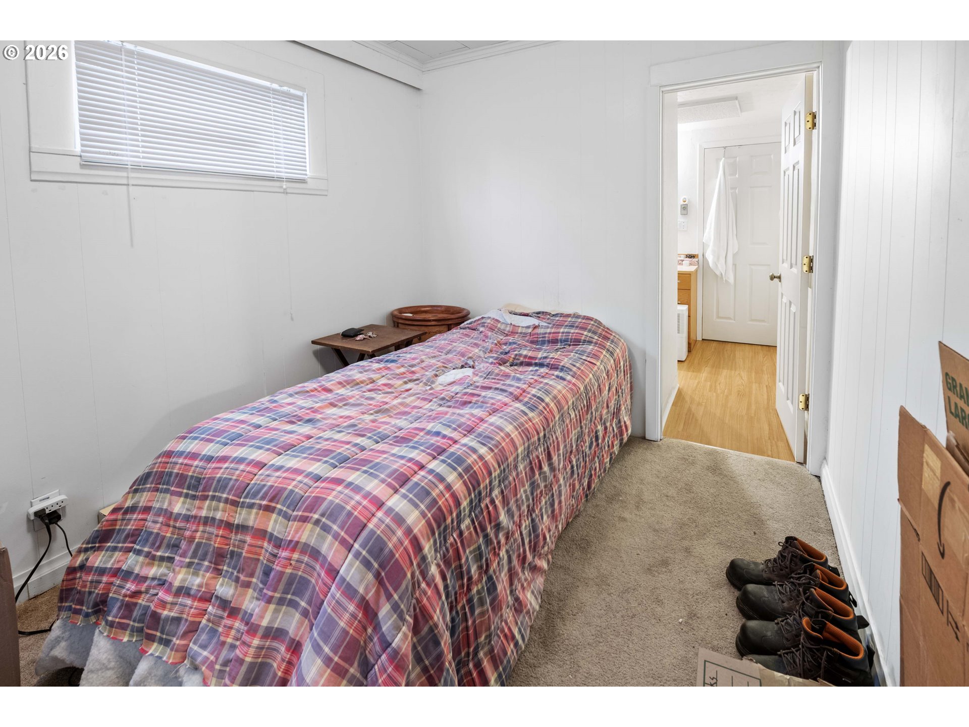 3496 Harrison Avenue Astoria, OR 97103 - Photo 11 of 18 a bedroom with a bed and a walk in closet