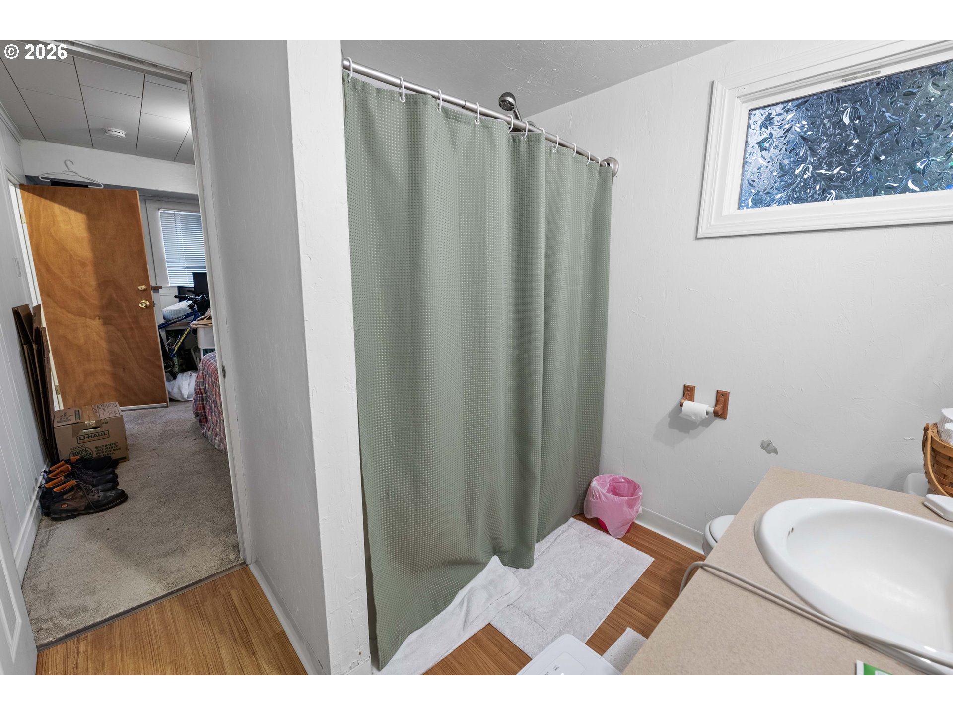 3496 Harrison Avenue Astoria, OR 97103 - Photo 12 of 18 a bathroom with a sink toilet and shower