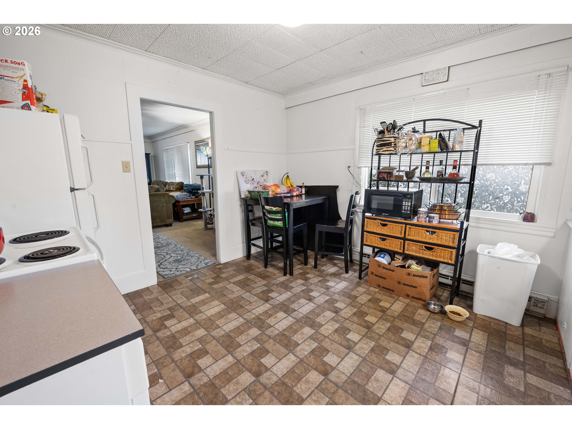 3496 Harrison Avenue Astoria, OR 97103 - Photo 7 of 18 a dining room with furniture and a table