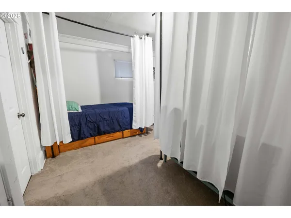 a view of a room with wooden door