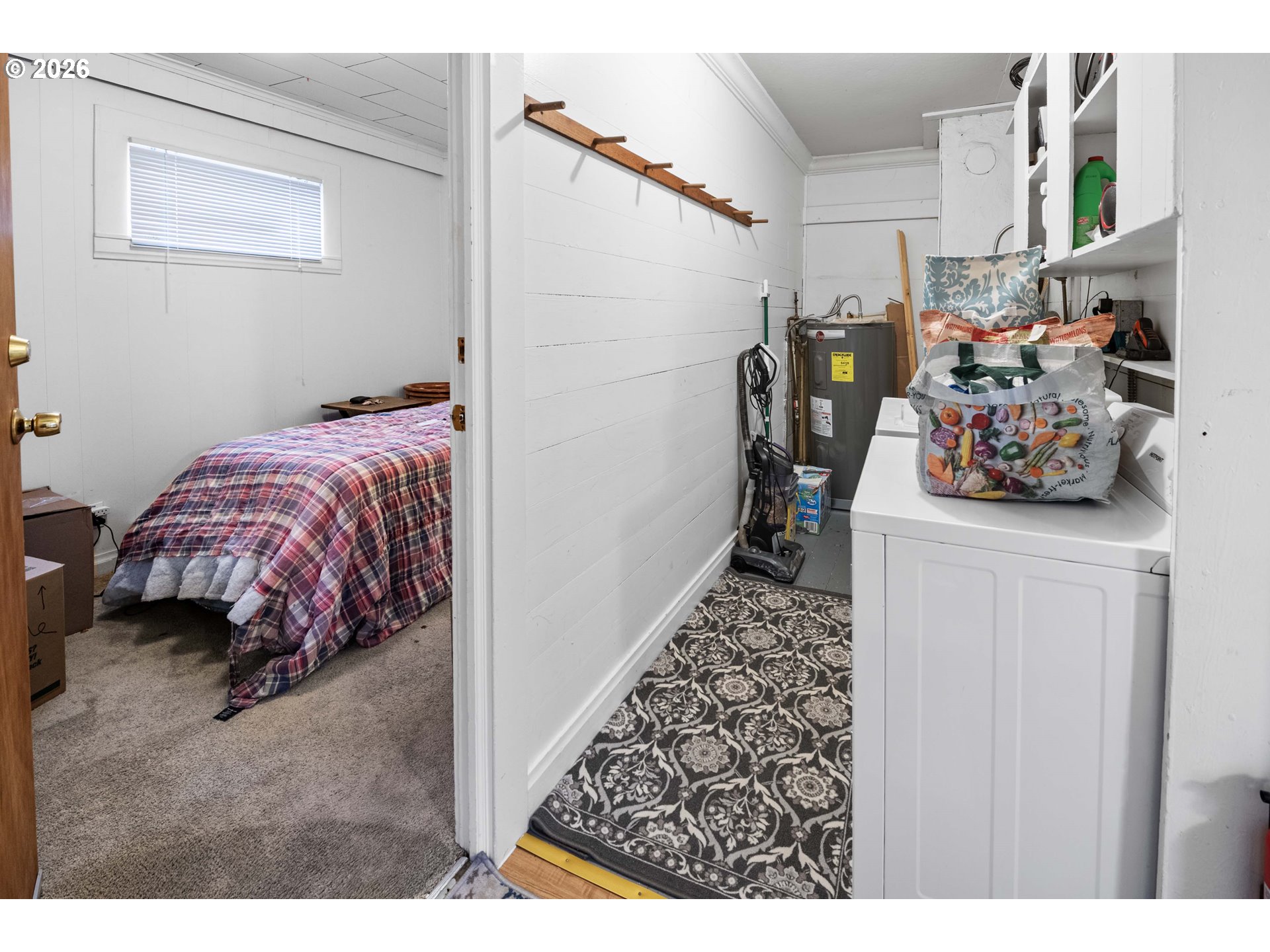 3496 Harrison Avenue Astoria, OR 97103 - Photo 10 of 18 a bed room with a bed and a car