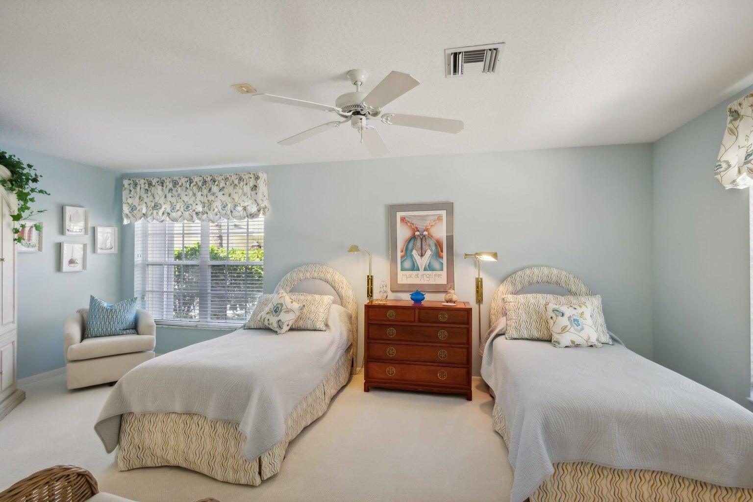 16481 Riverwind Drive Jupiter, FL 33477 - Photo 28 of 49 a bedroom with a bed couches and window