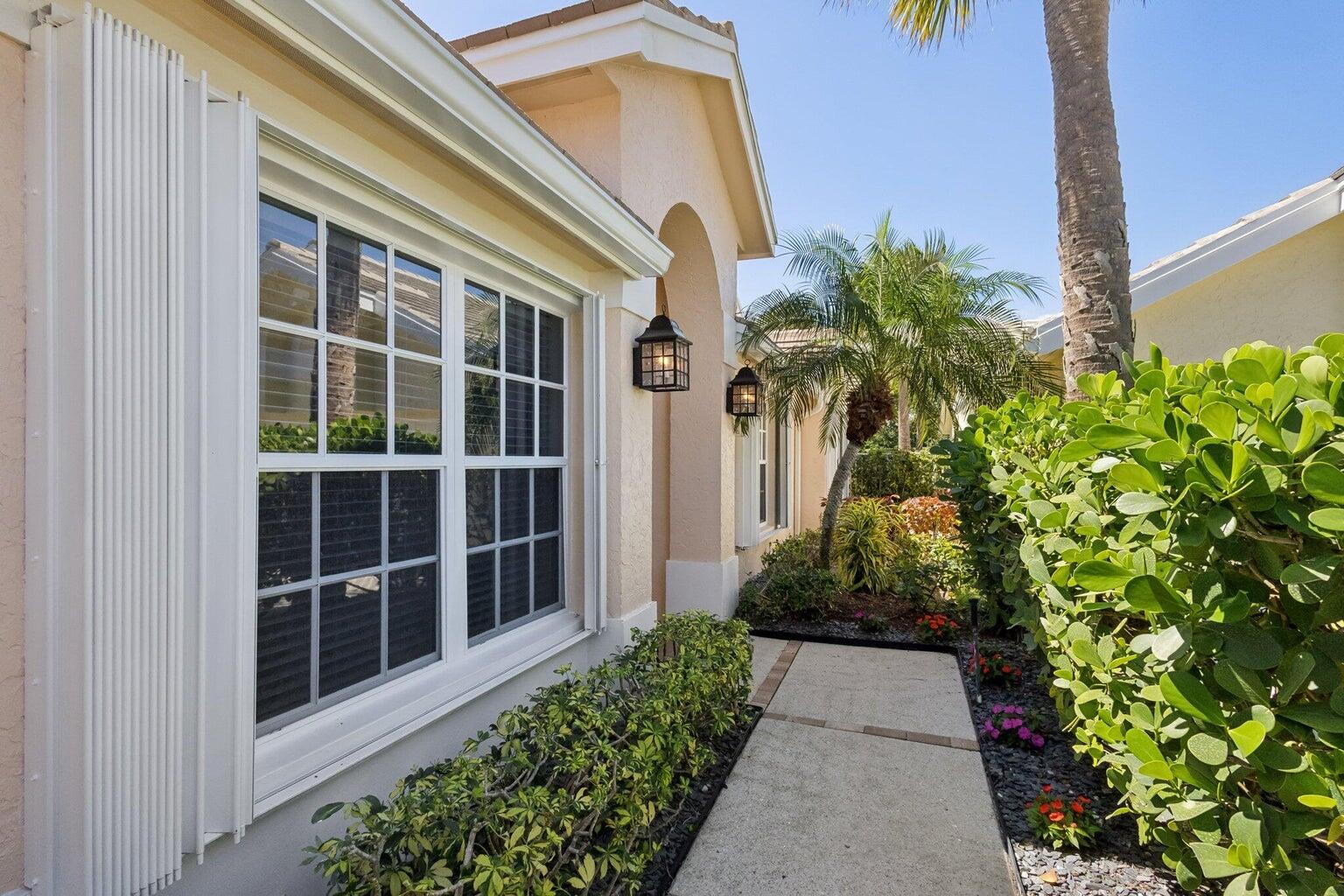 16481 Riverwind Drive Jupiter, FL 33477 - Photo 42 of 49 a view of a pathway besides a building