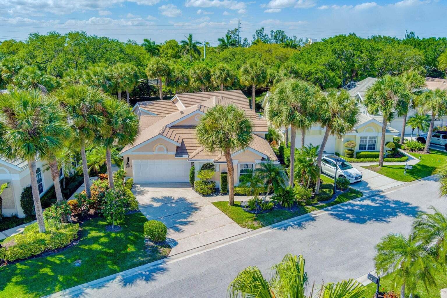 16481 Riverwind Drive Jupiter, FL 33477 - Photo 49 of 49 a view of a garden with potted plants