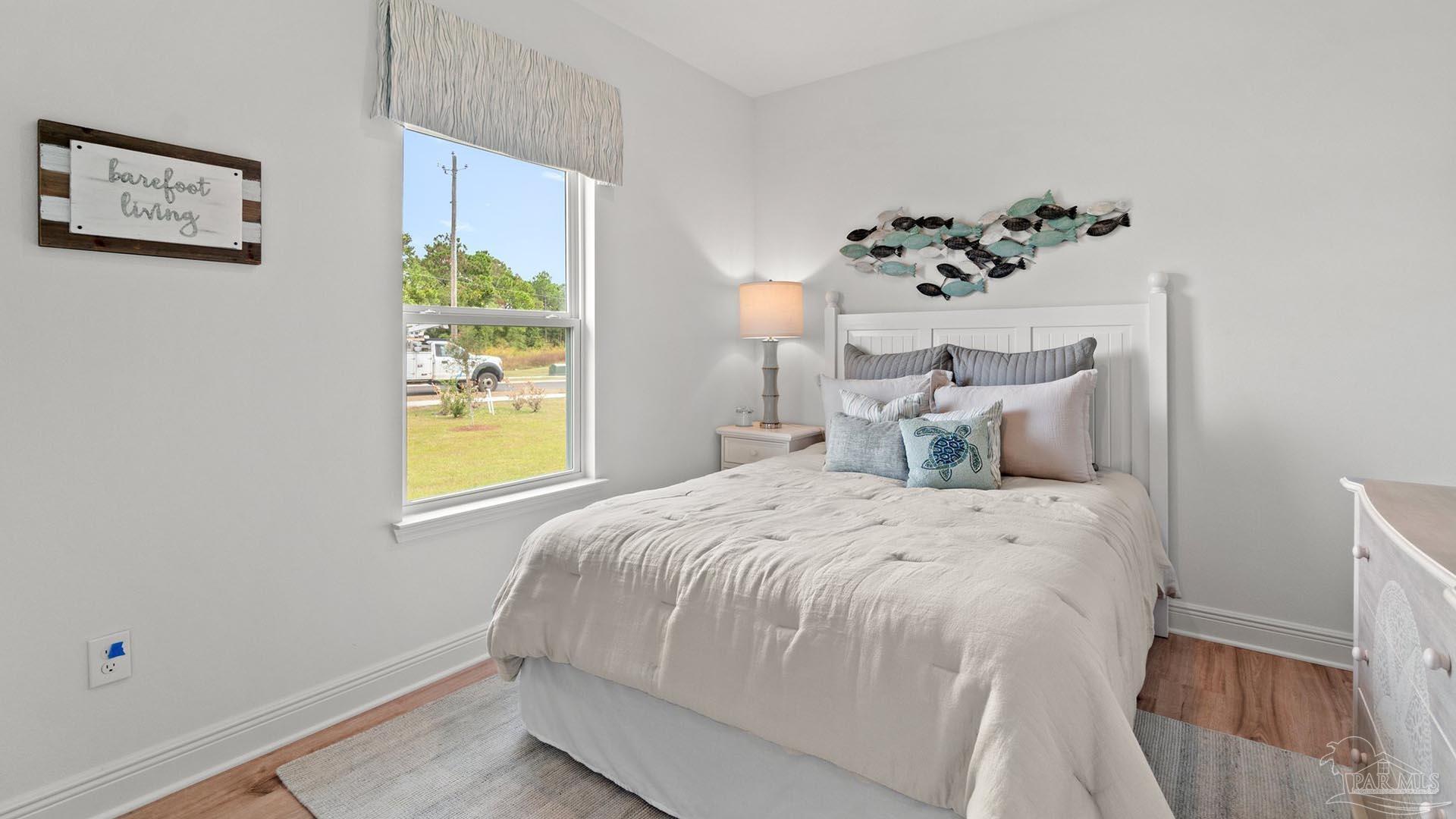 3080 Daybreak Lane Milton, FL 32571 - Photo 15 of 15 a bedroom with a bed and a window