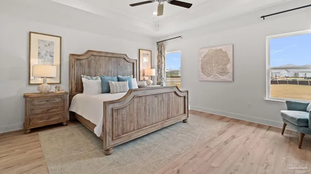 a bedroom with a bed a couch and dresser