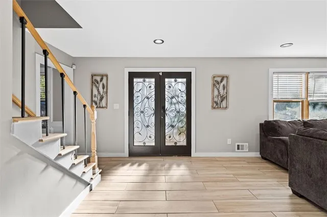 a view of a livingroom with furniture and windows