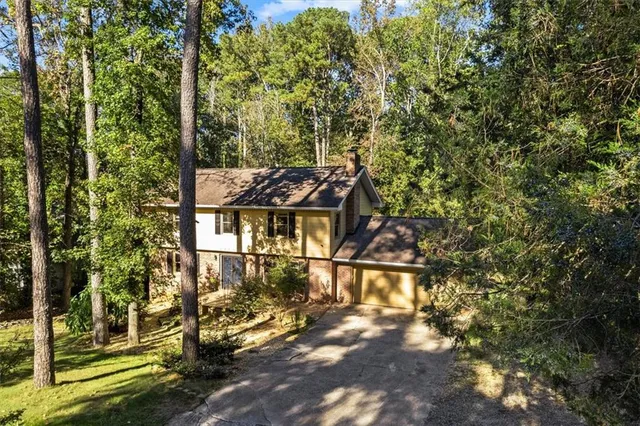 a view of a large building with a tree