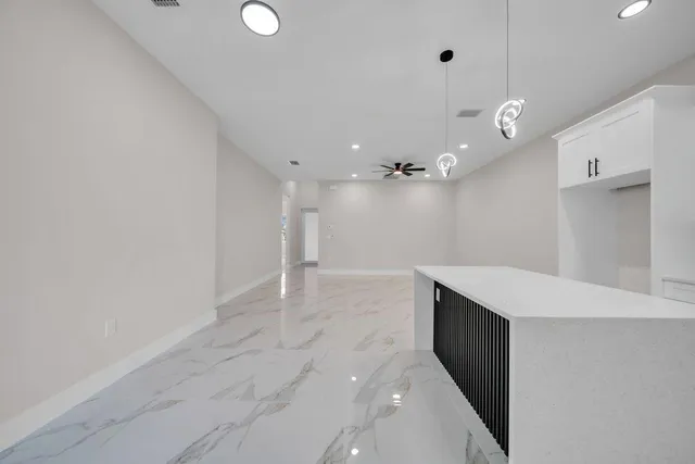 a bathroom with a sink a vanity and a shower