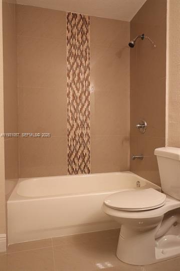 1861 Northwest 59th Way, Unit 2 Sunrise, FL 33313 - Photo 6 of 11 a bathroom with a toilet and a shower