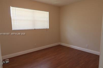 1861 Northwest 59th Way, Unit 2 Sunrise, FL 33313 - Photo 8 of 11 an empty room with a window