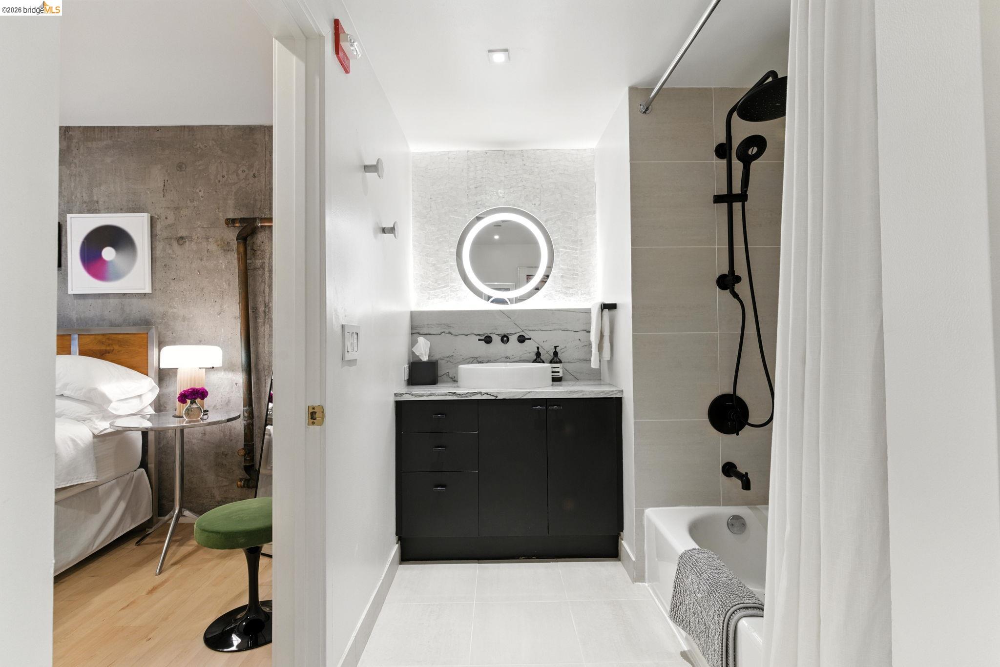 311 Oak Street, Unit 102 Oakland, CA 94607 - Photo 21 of 52 a bathroom with a sink a toilet and shower