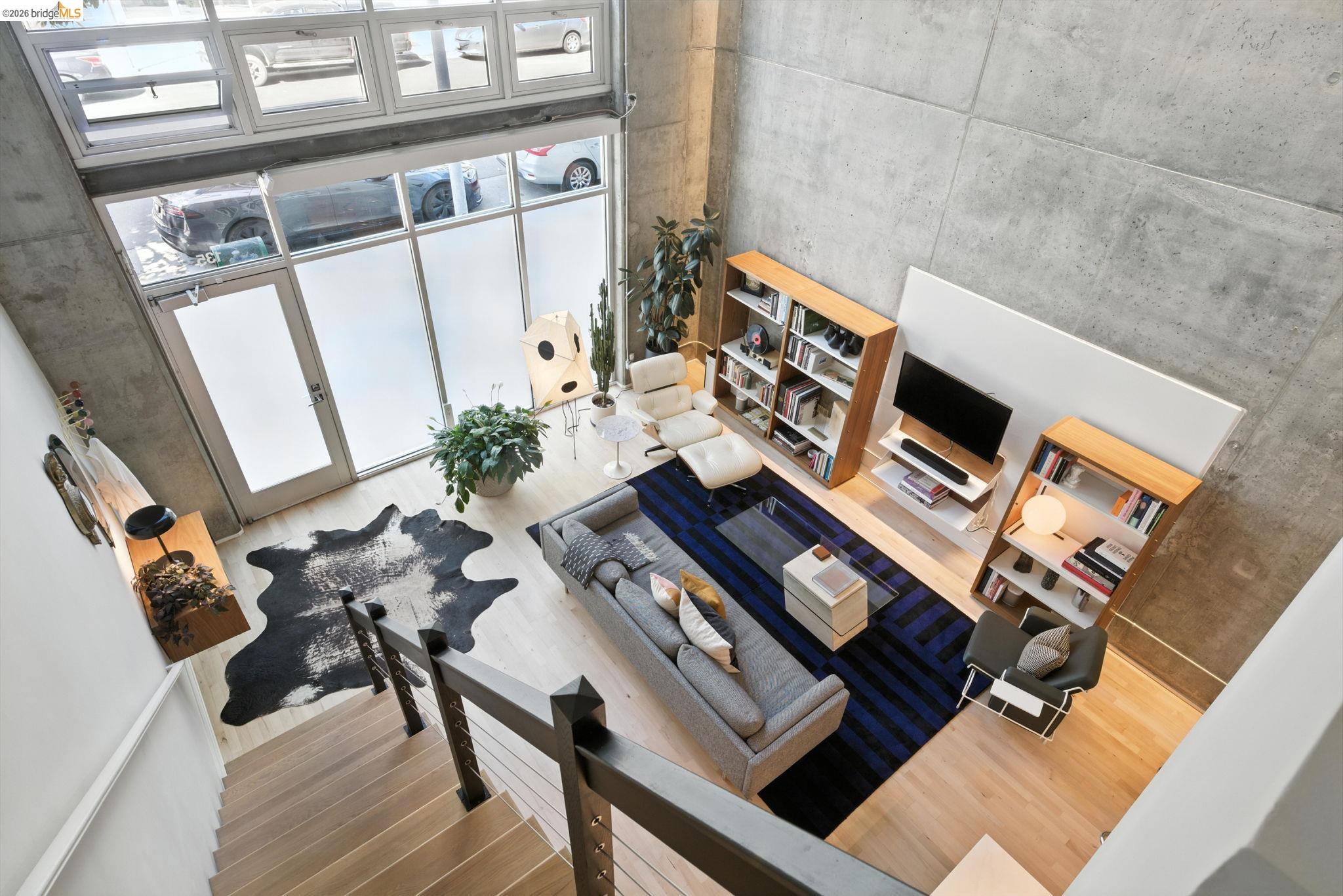 311 Oak Street, Unit 102 Oakland, CA 94607 - Photo 23 of 52 a view of balcony with furniture and wooden floor