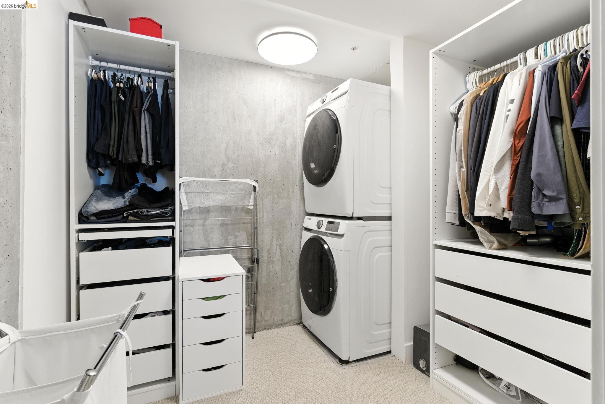 311 Oak Street, Unit 102 Oakland, CA 94607 - Photo 27 of 52 a view of walk in closet with clothes and shoes
