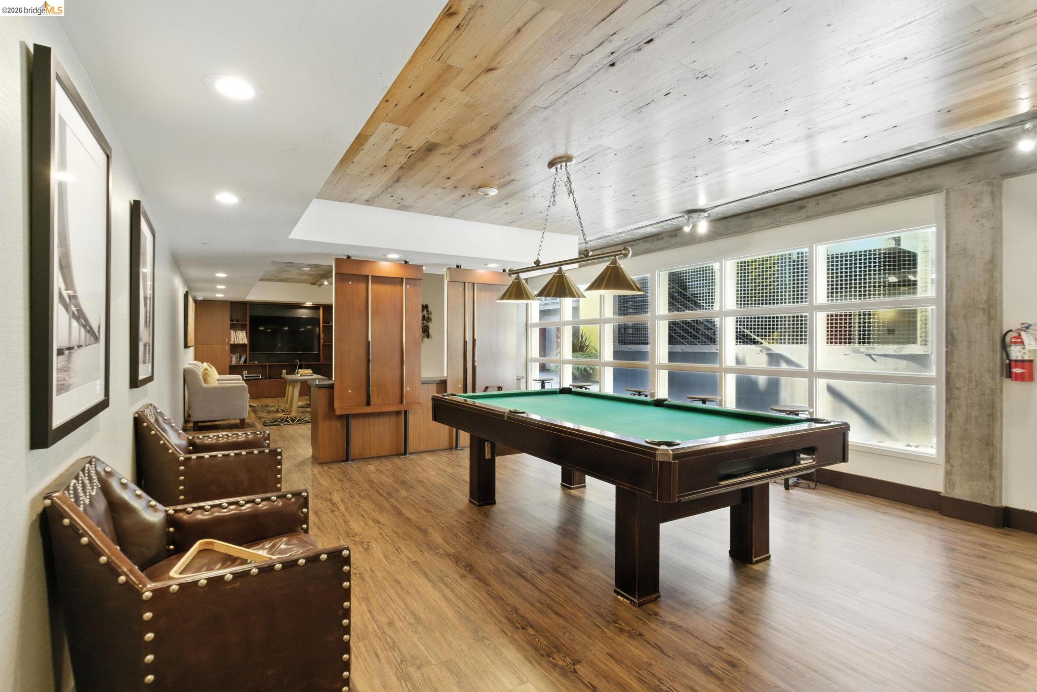 311 Oak Street, Unit 102 Oakland, CA 94607 - Photo 38 of 52 a room with pool table and windows