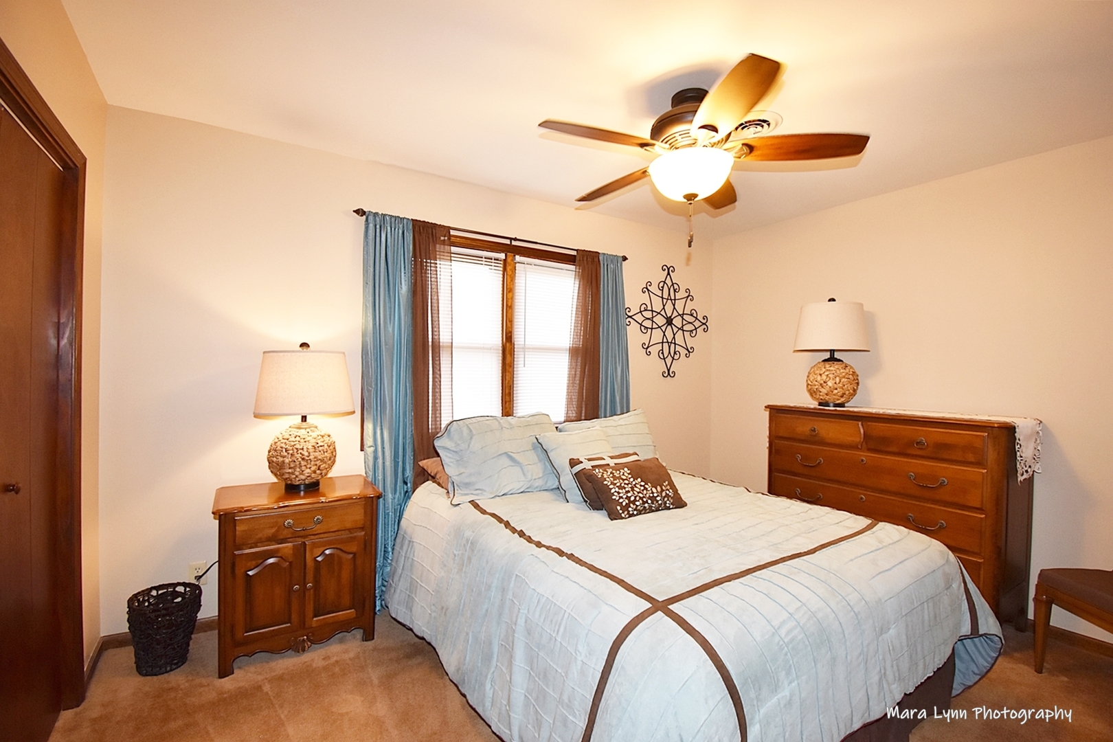1250 Mettel Road Aurora, IL 60505 - Photo 34 of 49 a bedroom with a bed and a chandelier