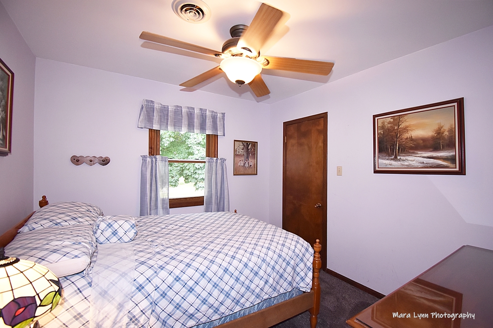 1250 Mettel Road Aurora, IL 60505 - Photo 36 of 49 a bedroom with a bed and a chandelier