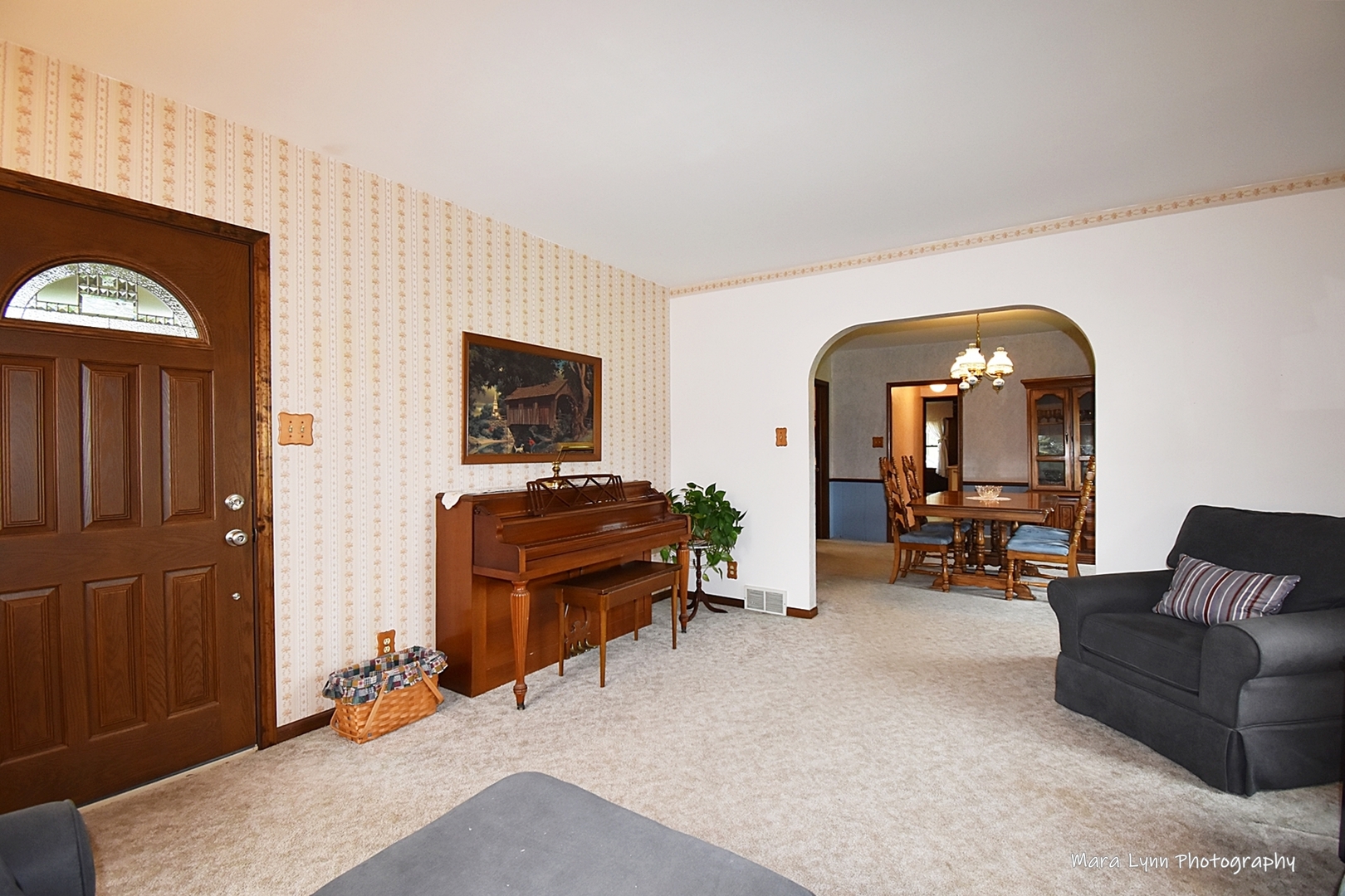 1250 Mettel Road Aurora, IL 60505 - Photo 6 of 49 a living room with furniture and a flat screen tv