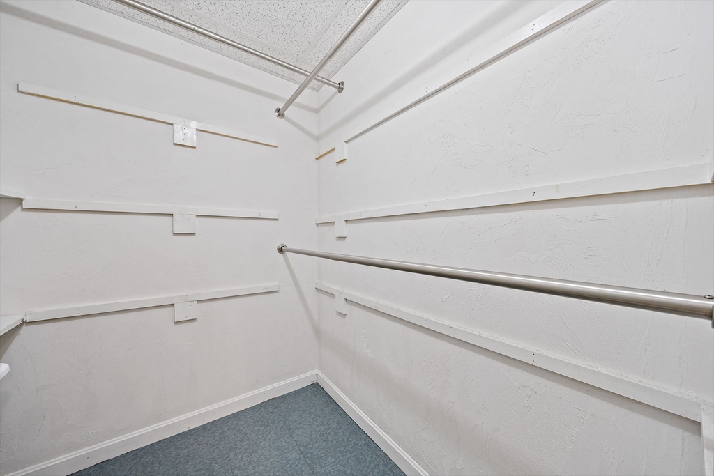 501 Auburn Street, Unit 404 Whitman, MA 02382 - Photo 20 of 35 a view of a room with racks on the wall