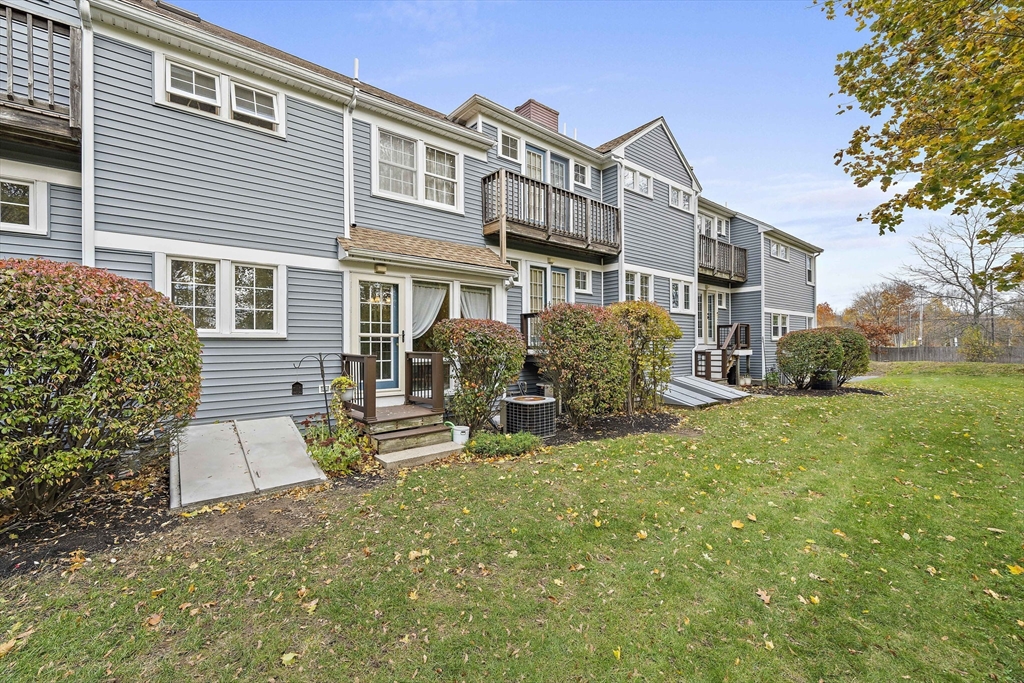 501 Auburn Street, Unit 404 Whitman, MA 02382 - Photo 29 of 35 a view of a house with a yard