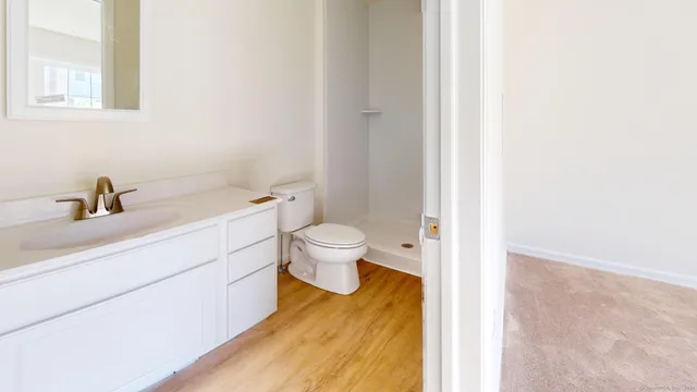 a kitchen with stainless steel appliances white cabinets and a stove
